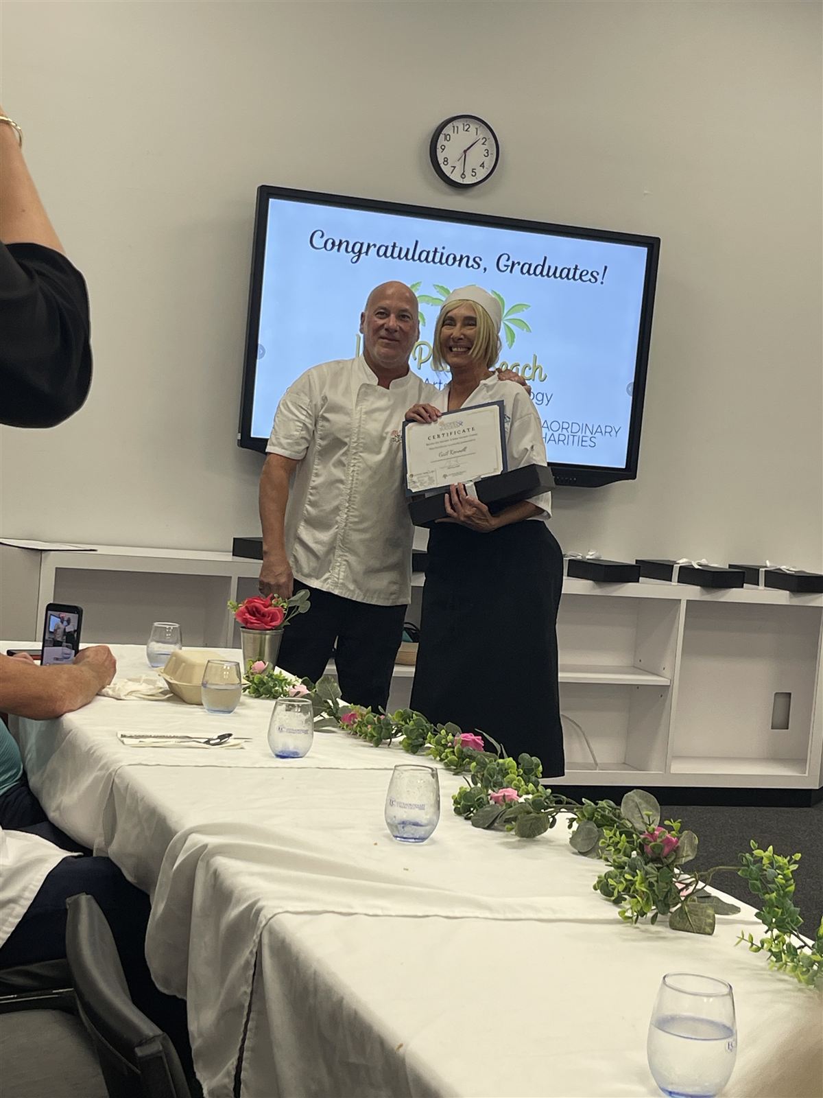 Graduate Gail Kennell receiving her certificate at the WPBCAT Culinary Workforce Development graduation
