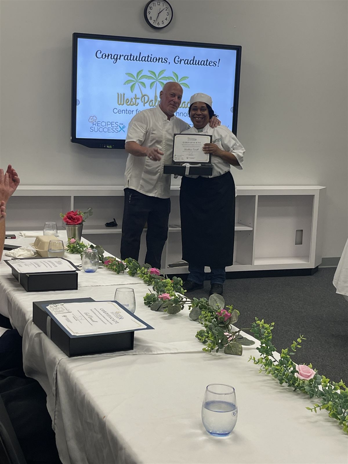 Graduate Shiobhan Terrell receiving her certificate at the WPBCAT Culinary Workforce Development graduation